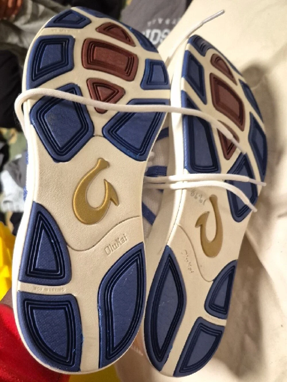 OluKai White Sneakers with Blue Webbing Accents